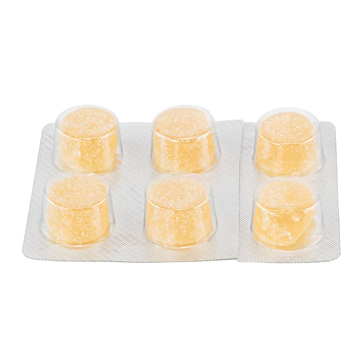 Shrumfuzed Max 9600MG Mushroom Gummies Mango gummies on a white background - Up N Smoke