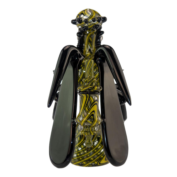 "Backside of a Shuhbuh GlassWorks Wasp Rig, showcasing the matching carb cap that is made using the 'sleeve' glassblowing method," - Up N Smoke.