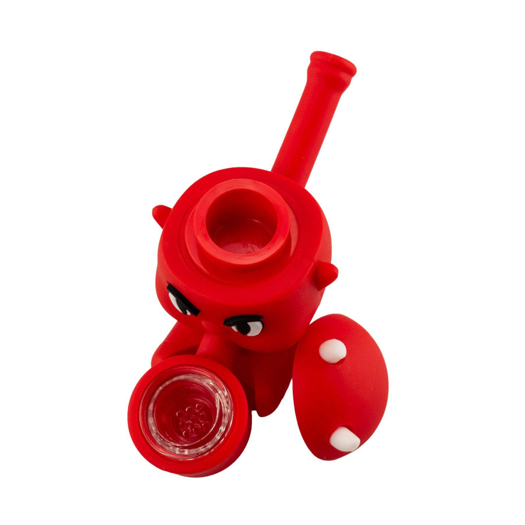 "Top-down view of a Silicone Devil Hand Pipe with its storage department lid leaning against the bodice," - Up N Smoke.
