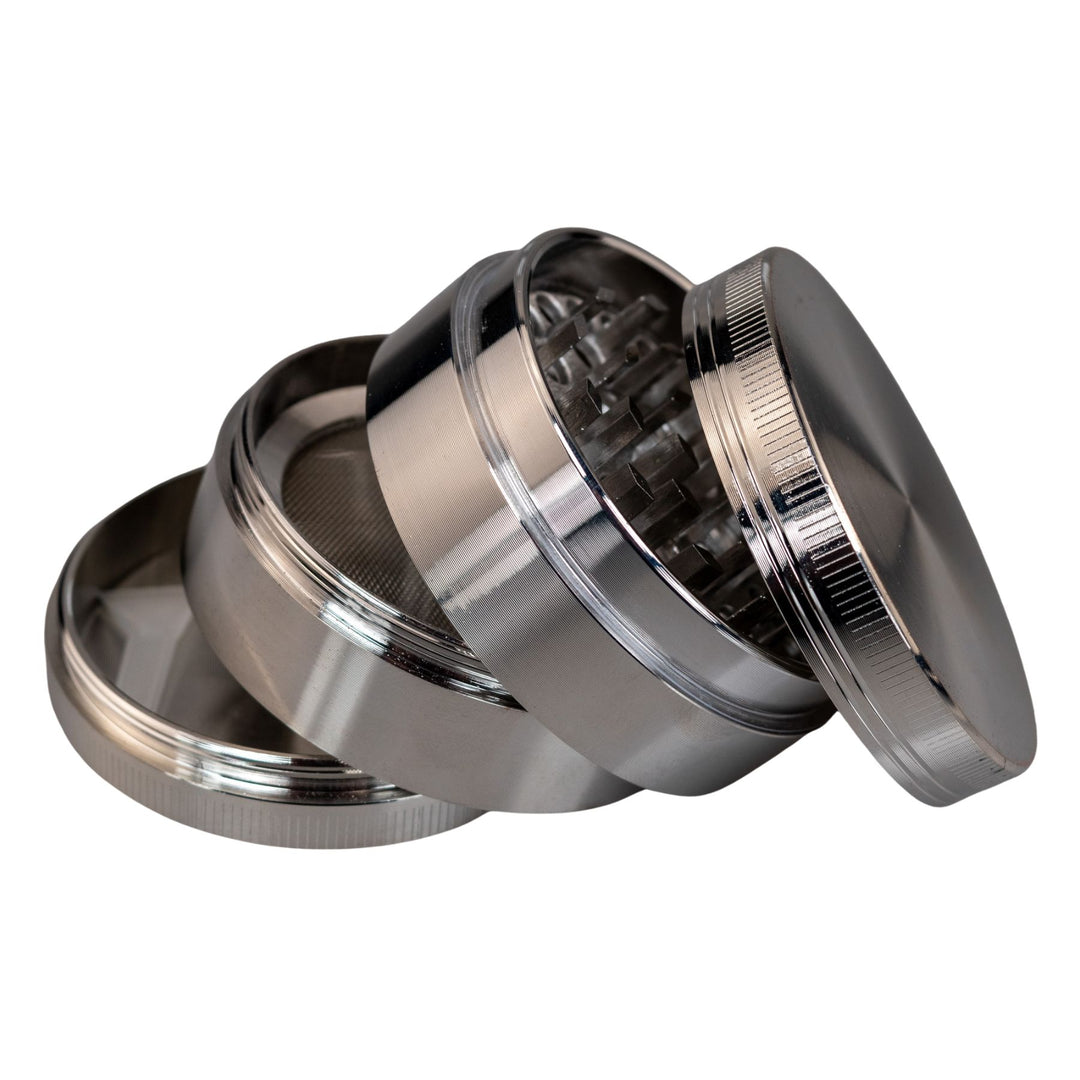 "Silver Classic 4-Piece Grinder with all four compartments separated and stacked upon one another," - Up N Smoke.