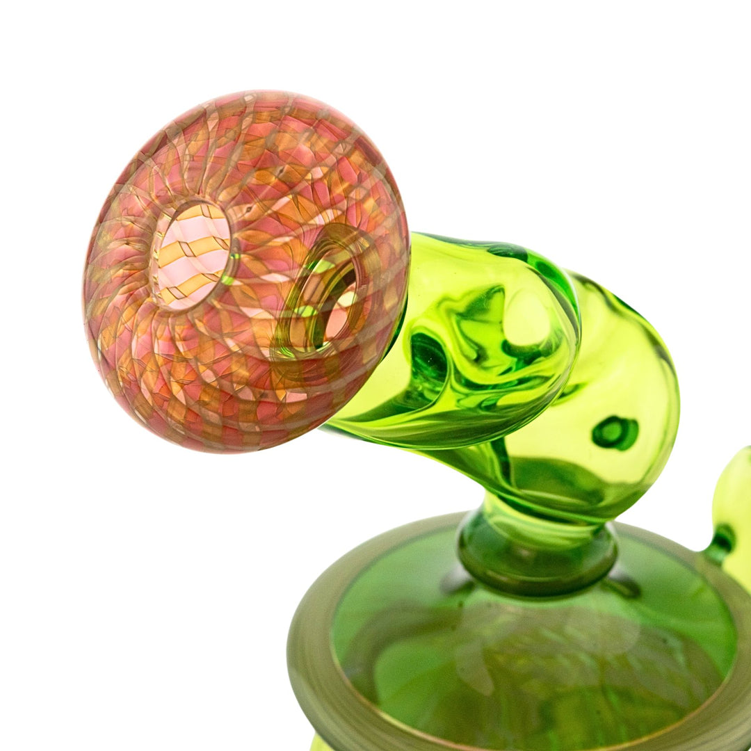"Right side of the mouthpiece to a Sol Fire Glass Weed Fairy Recycler on a white background," - Up N Smoke.