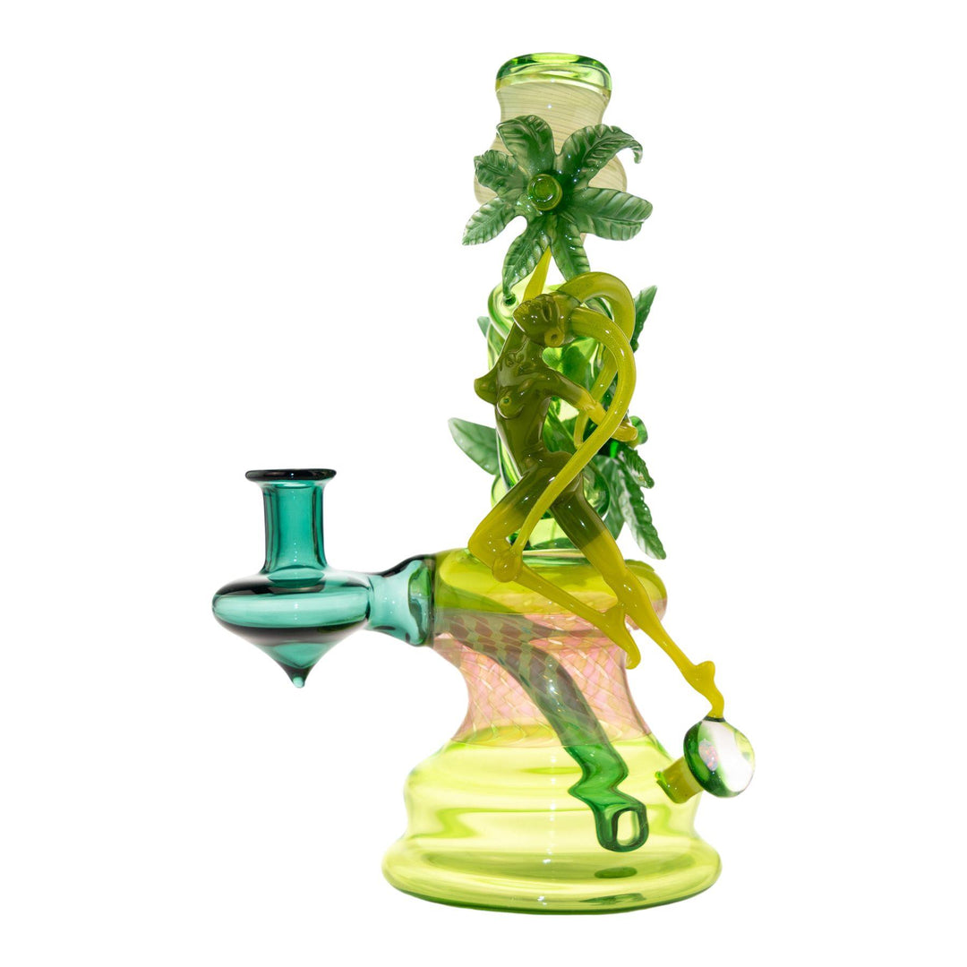 "Left side of a Sol Fire Weed Fairy Bubbler that is handblown and American-made on a white background," - Up N Smoke.
