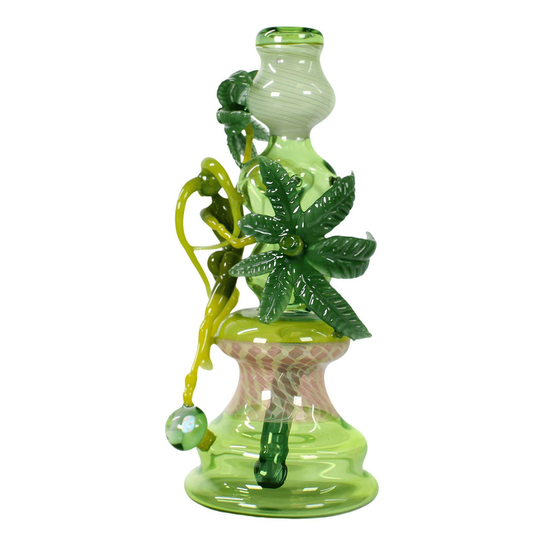 "Backside of a Sol Fire Weed Fairy Bubbler Heady piece that is adorned with hemp leaves around the bodice on a white background," - Up N Smoke.