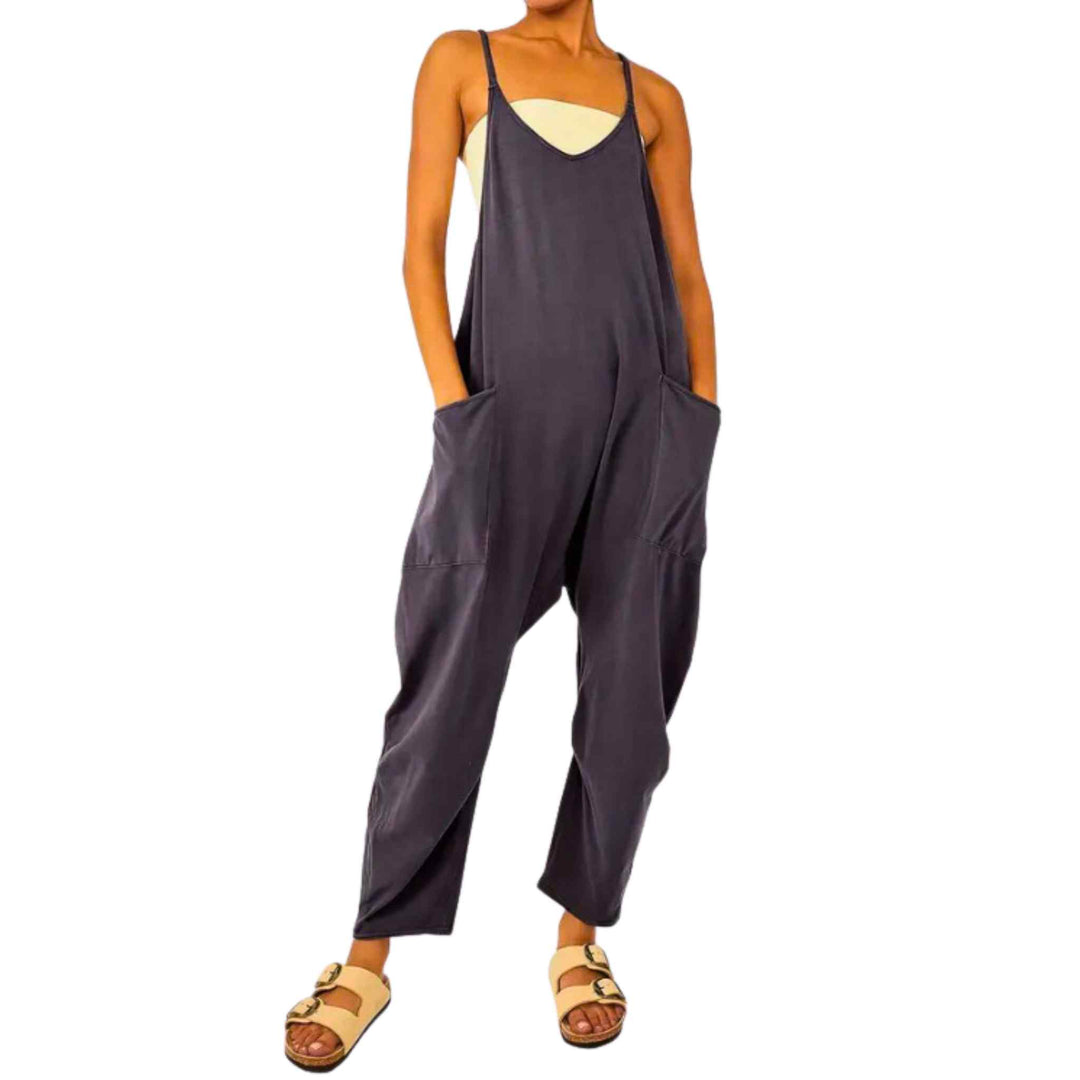 Model posing in a spaghetti strap jumpsuit with long pockets - up n smoke