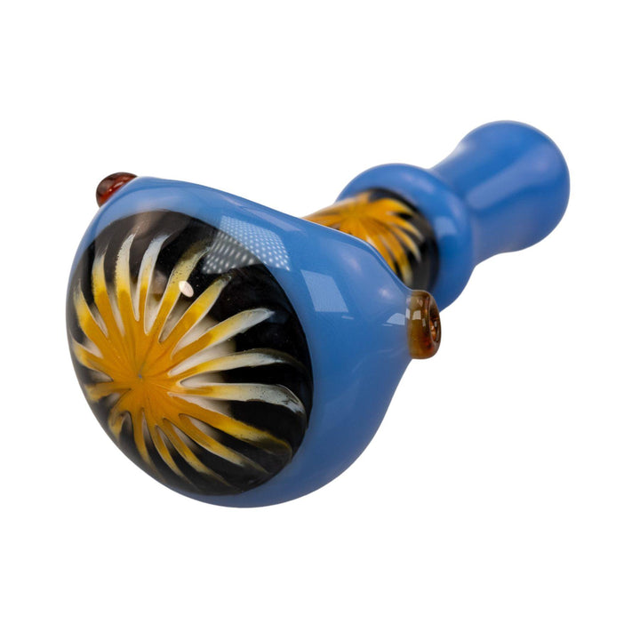 "Close-up of the yellow and black design on the bowl head of a Pulsar Step Into Now Herb Spoon," - Up N Smoke.