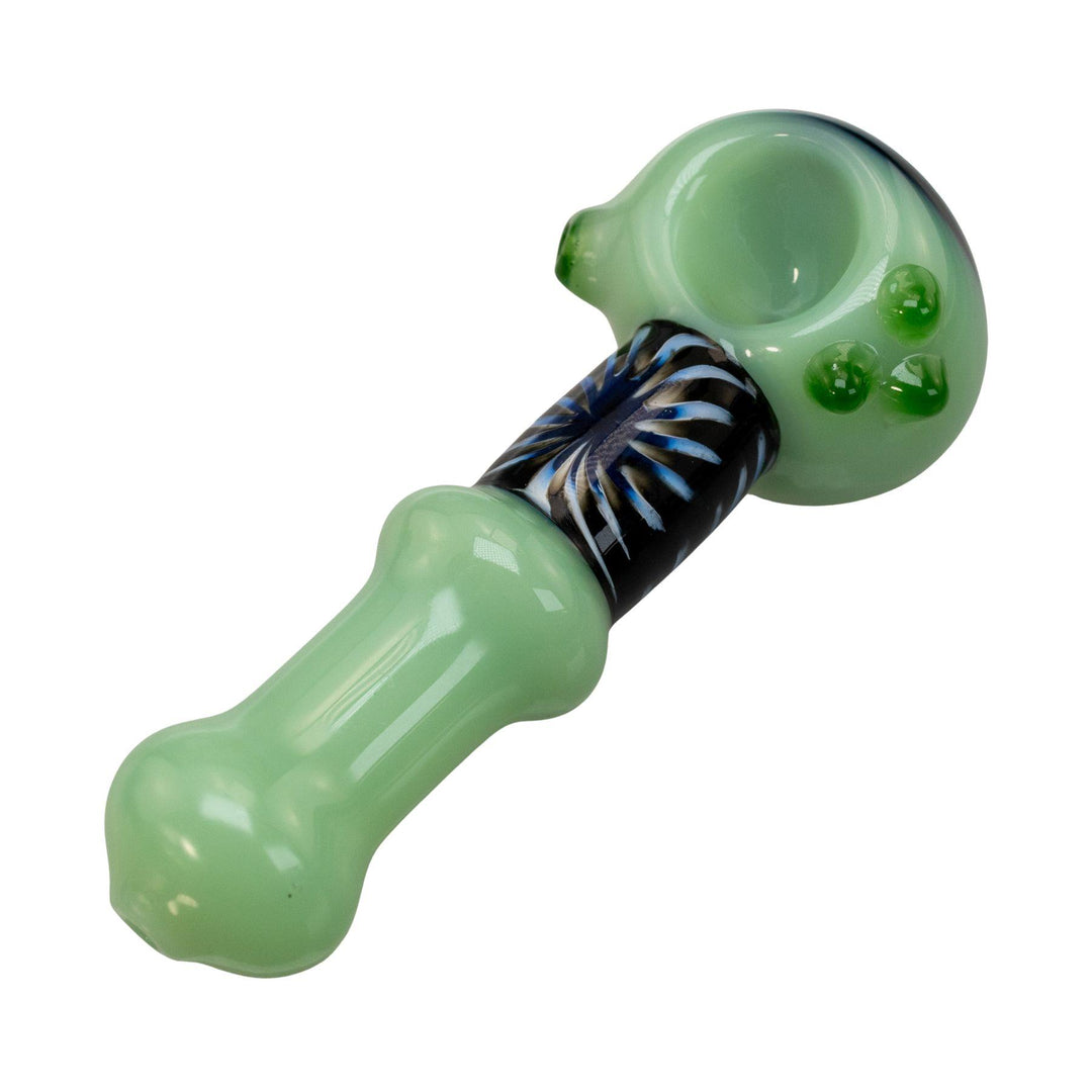 "Pulsar Step Into Now Herb Spoon in green with a blue and black sunburst design wrapped around the neck and bowl head," - Up N Smoke.