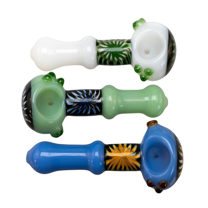 "Three glass pipes sold by Pulsar in the colors white, green, and blue on a white background," - Up N Smoke.