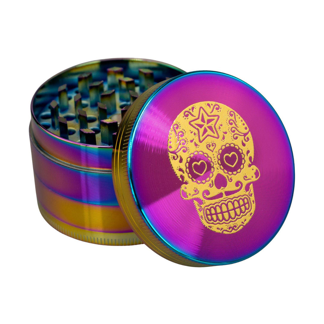 "Sugar Skull 4-Piece Grinder with its lid leaned up against the rest of the tool on a white background," - Up N Smoke.