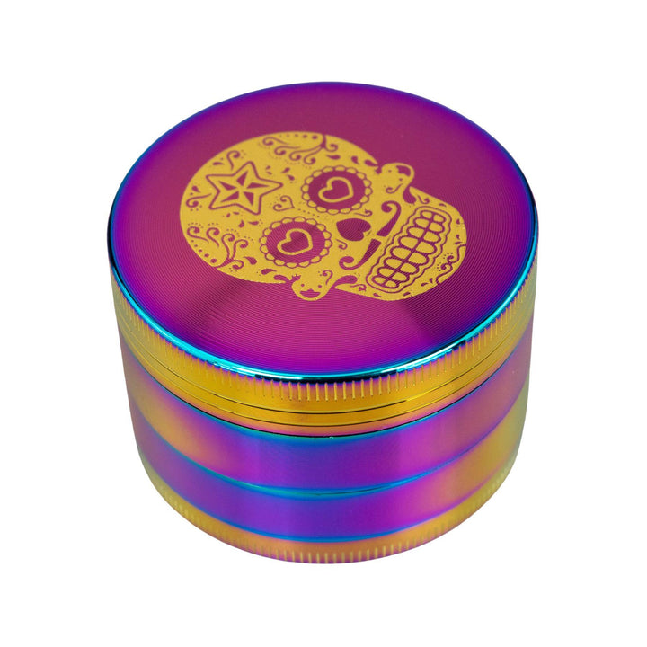 "Sugar Skull 4-Piece Grinder with an anodized finish and golden decal on top," - Up N Smoke.