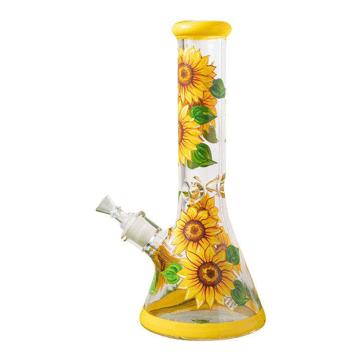 "A hand-painted sunflower water pipe, featuring vibrant yellow sunflowers against a clear glass body. The design is detailed and bright, showcasing nature-inspired art." - Up N Smoke.