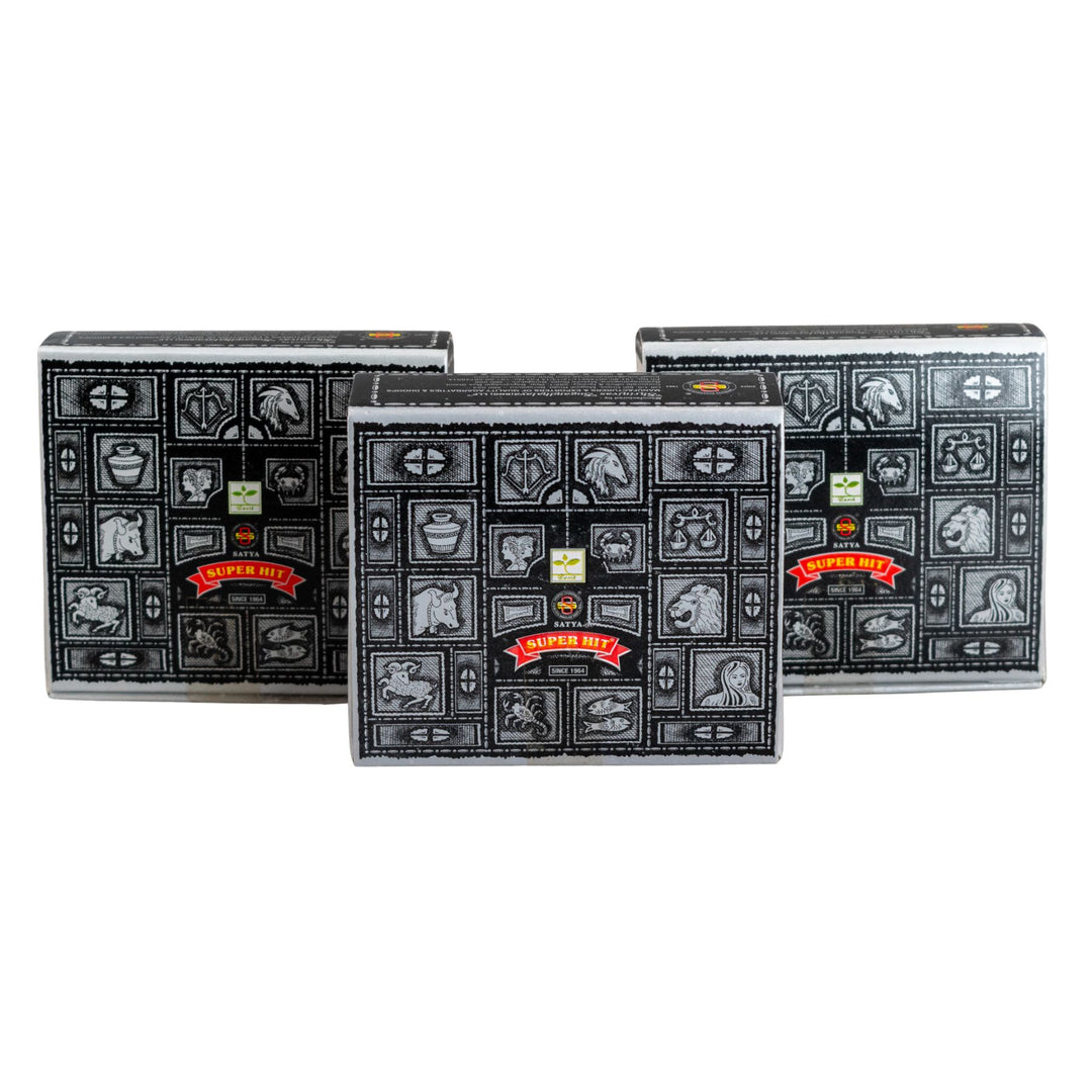 Three black boxes of Satya Super Hit Dhoop Cones on a white background