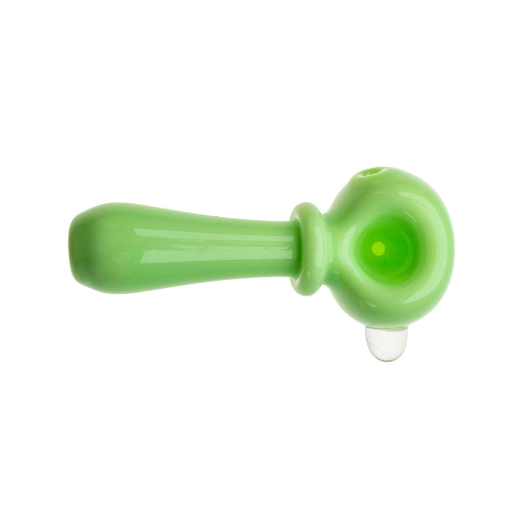 "Top down photograph of an opaque green herb spoon made by Tagle Glass," - Up N Smoke.