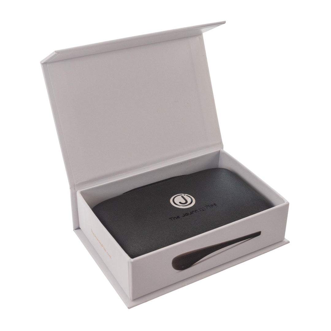 "Open box of The Journey Pipe J2, showcasing the travel case the product comes with on a white background," - Up N Smoke.