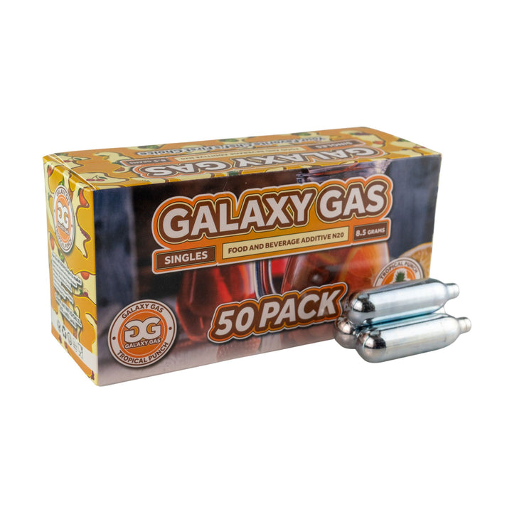 "Side angle of a Tropical Punch 50ct Galaxy Gas box with three cartridges in front on a white background," - Up N Smoke.