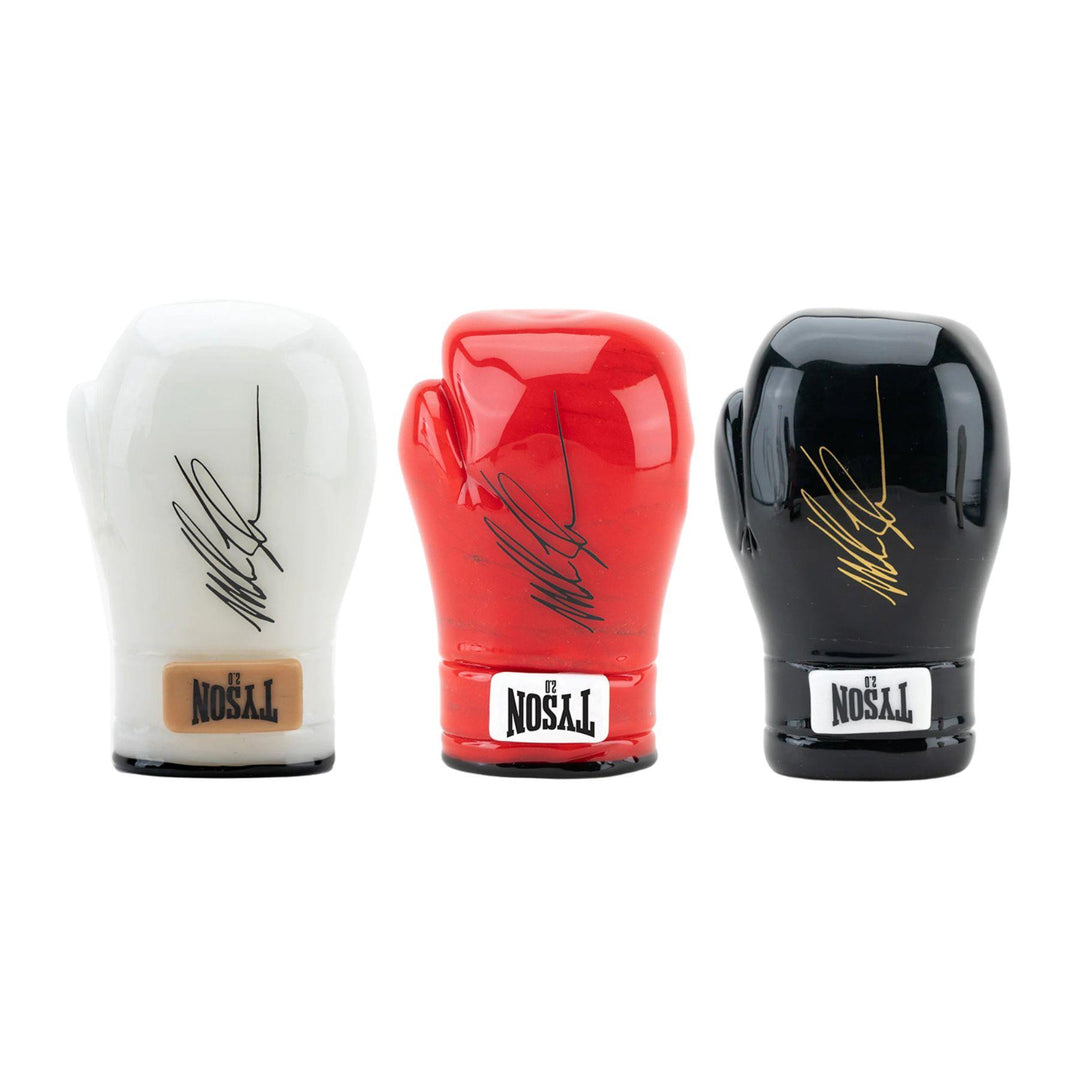 "Group photo of three Mike Tyson Glove hand pipes in different colors, featuring a bowl in the palm of the glove and Mike Tyson's signature on the exterior." - Up N Smoke.