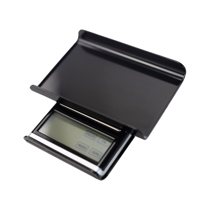 Top down view of an US-Absolute scale with its lid flipped upside down to be utilized as a tray. This product features the largest pocket-sized scale touch screen and can read six different forms of weight. - Up N Smoke.