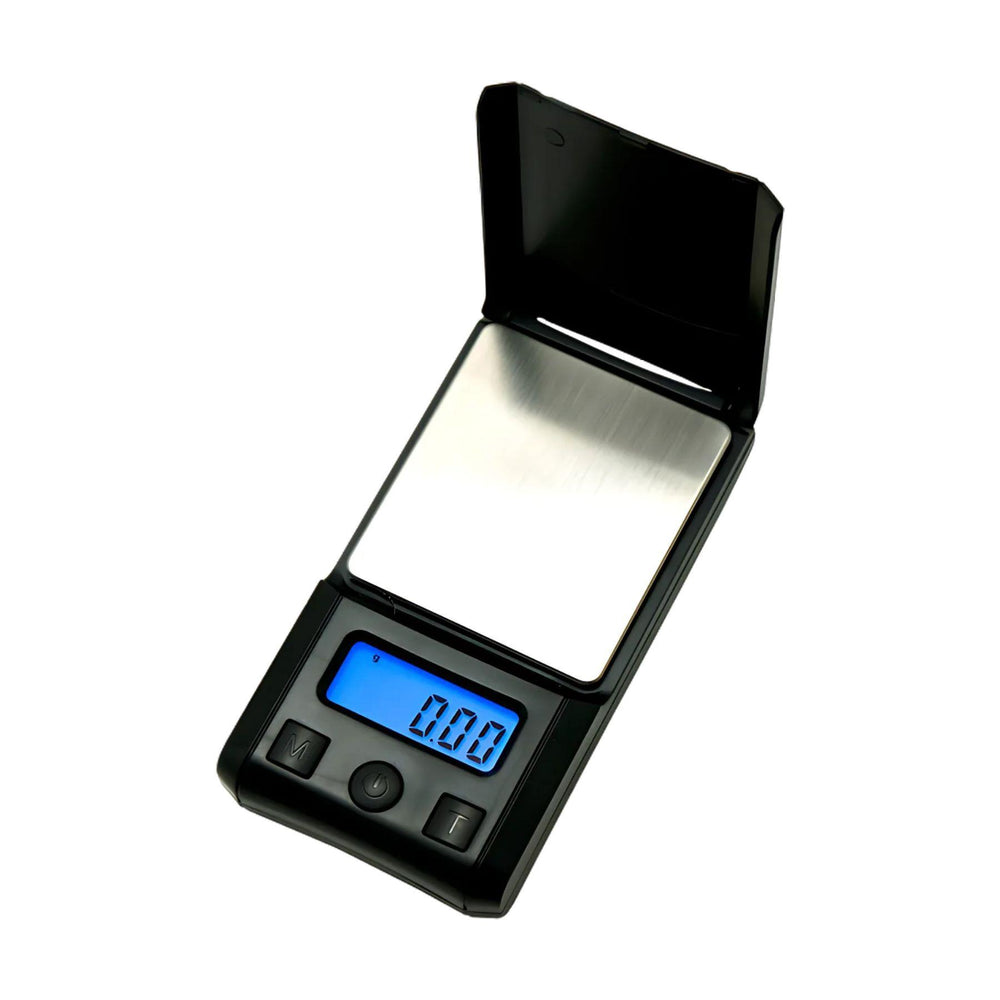 "The US-NUEVO PLUS Pocket Scale, shown open with its sleek black design and stainless steel weighing platform." - Up N Smoke.