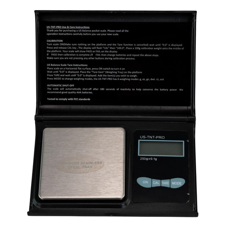 "Digital pocket scale with stainless steel platform and black casing on a white background," - Up N Smoke.