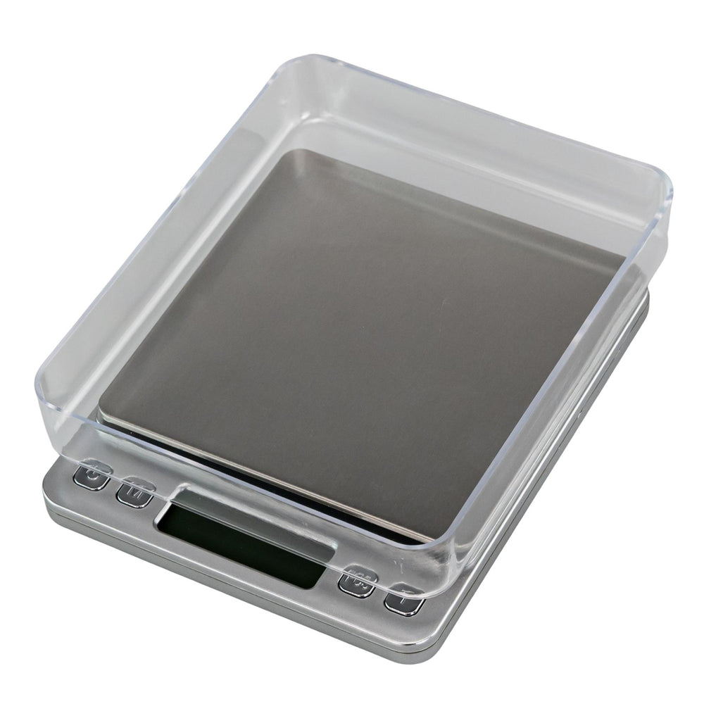 "Digital kitchen scale with clear lid on a white background," - Up N Smoke.