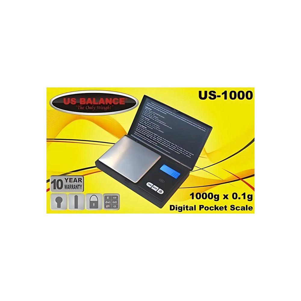 "The US-1000 pocket-sized scale from US Balance, displayed in its packaging, highlighting its sleek black design and key features." - Up N Smoke.