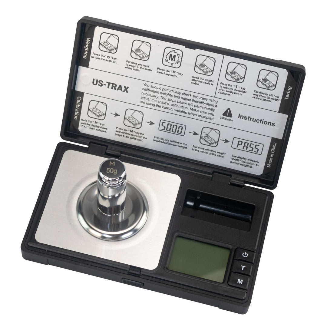 US-Trax 50g x 0.001g Pocket Scale top down with calibration weight displayed on a white background - Up N Smoke