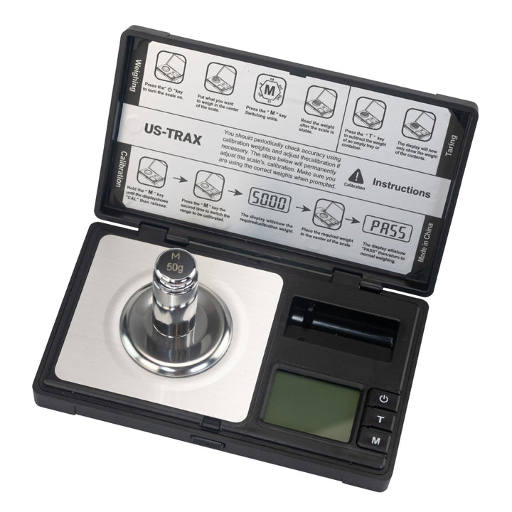 US-Trax 50g x 0.001g Pocket Scale top down with calibration weight displayed on a white background - Up N Smoke