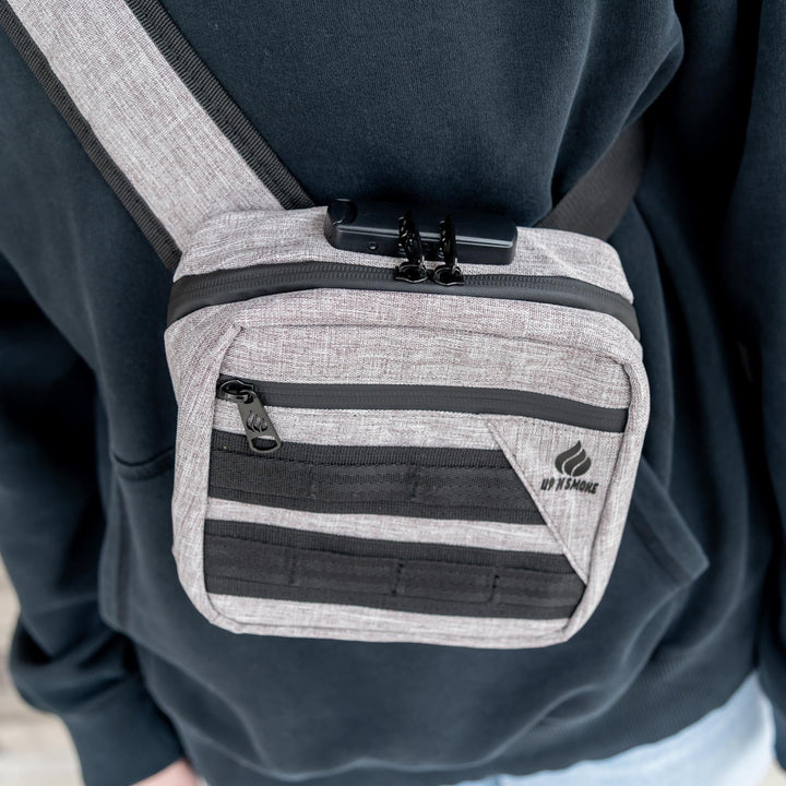 Up N Smoke Smell-Proof Locking Crossbody Bag grey high angle styled photo with bag being worn - Up N Smoke