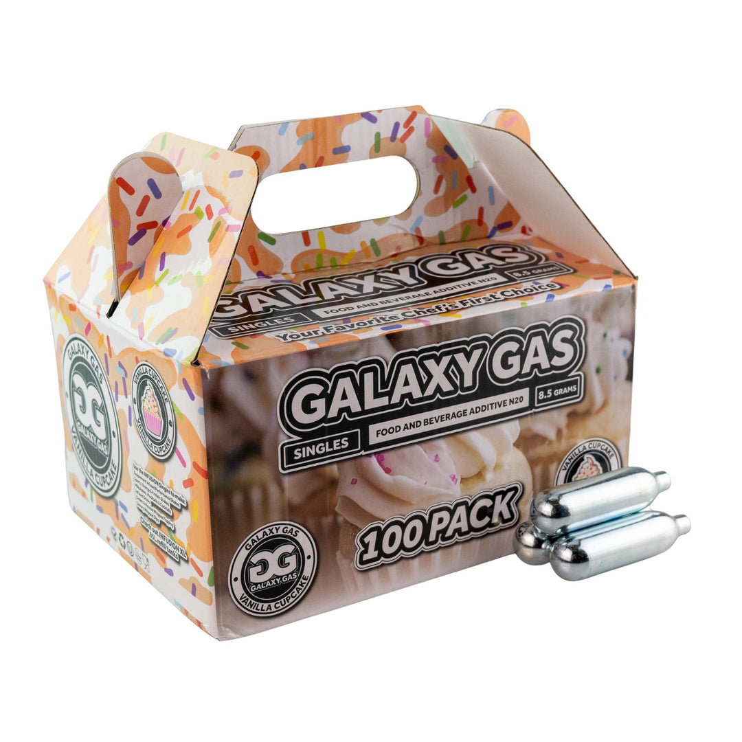 "Side angle of a 100ct box of Vanilla Cupcake Galaxy Gas with three cartridges in front on a white background," - Up N Smoke.
