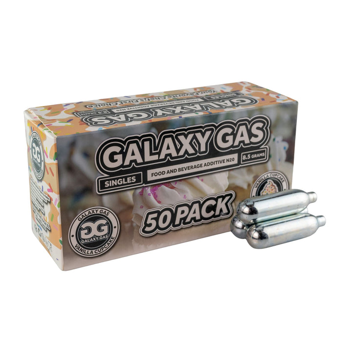 "Side angle of a 50ct box of Vanilla Cupcake Galaxy Gas with three cartridges in front on a white background," - Up N Smoke.