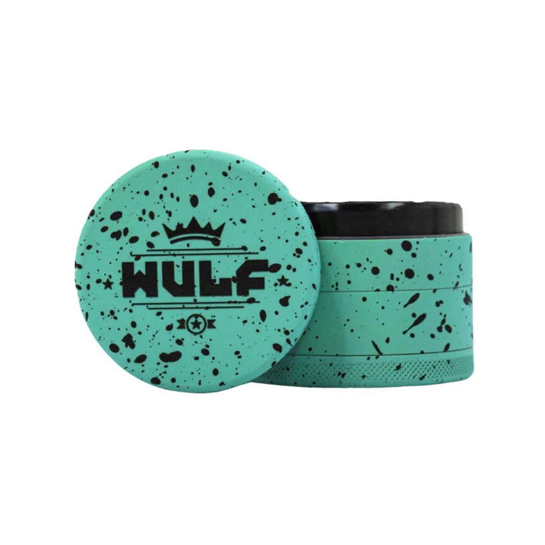 "Teal and black WULF 50mm 4-Piece Grinder on a white background," - Up N Smoke.