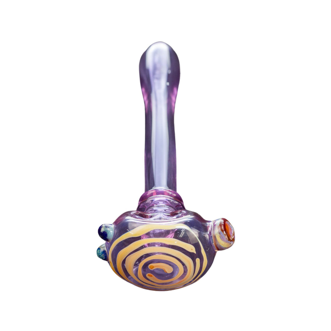 Top down frontal view of a Washboard purple spoon. This is a clear purple piece that features a cream-colored spiral on the head of the pipe. It is adorned with three blue bubbles on the right side, and a multi-color carb on the left. - Up N Smoke.