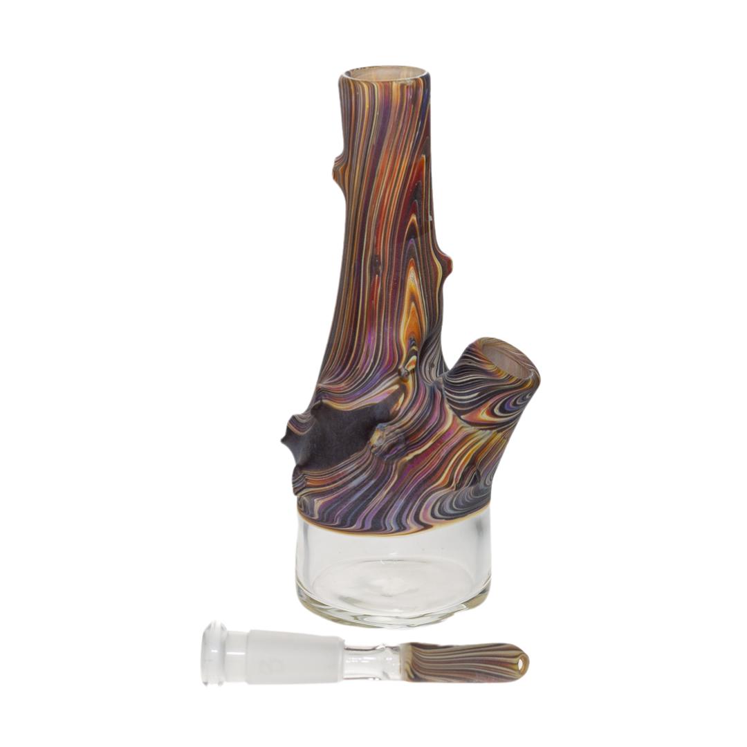 Side right view of a Wazoo Wood Sake Bottle. This water pipe features a wood-grain pattern and a matching downstem. It is handcrafted by Jacob Wazoo, of Wazoo Glass.