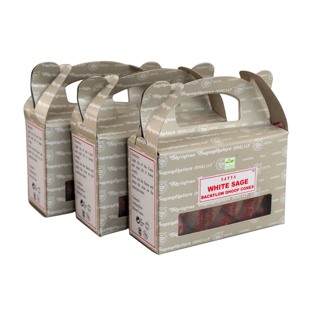 Three boxes of Satya White Sage Backflow Dhoop Cones on a white background