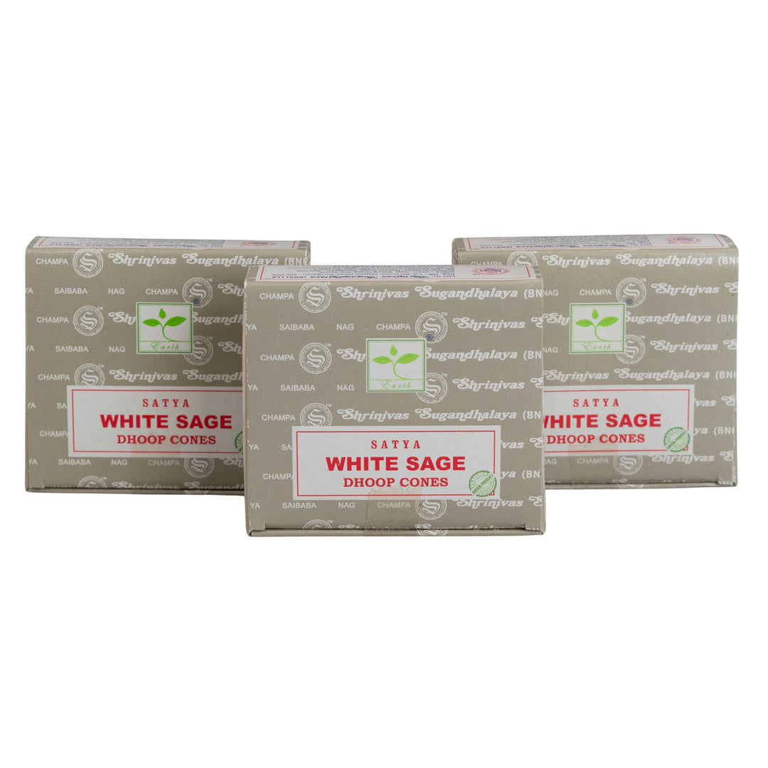 Three boxes of Satya White Sage Dhoop Cones on a white background