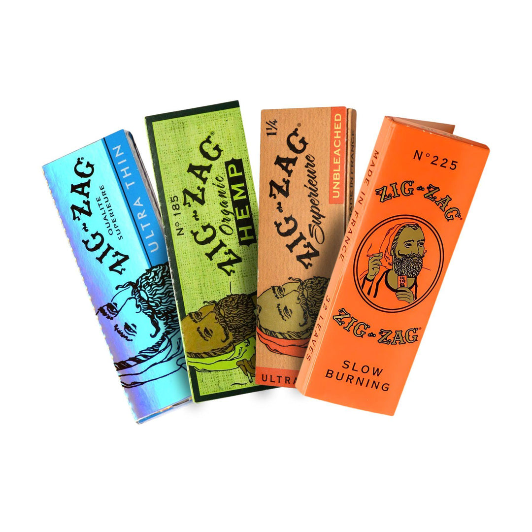 "A group photograph of four different kinds of 1 1/4 Zig Zag rolling papers." - Up N Smoke.