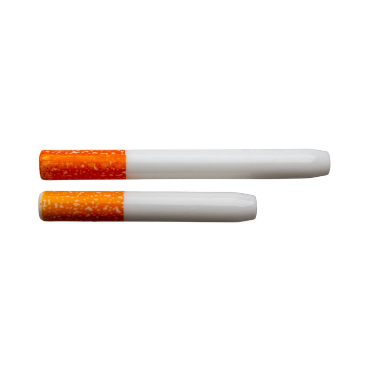 "Two ceramic quartz dugout bats that look like a cigarette on a white background," - Up N Smoke.
