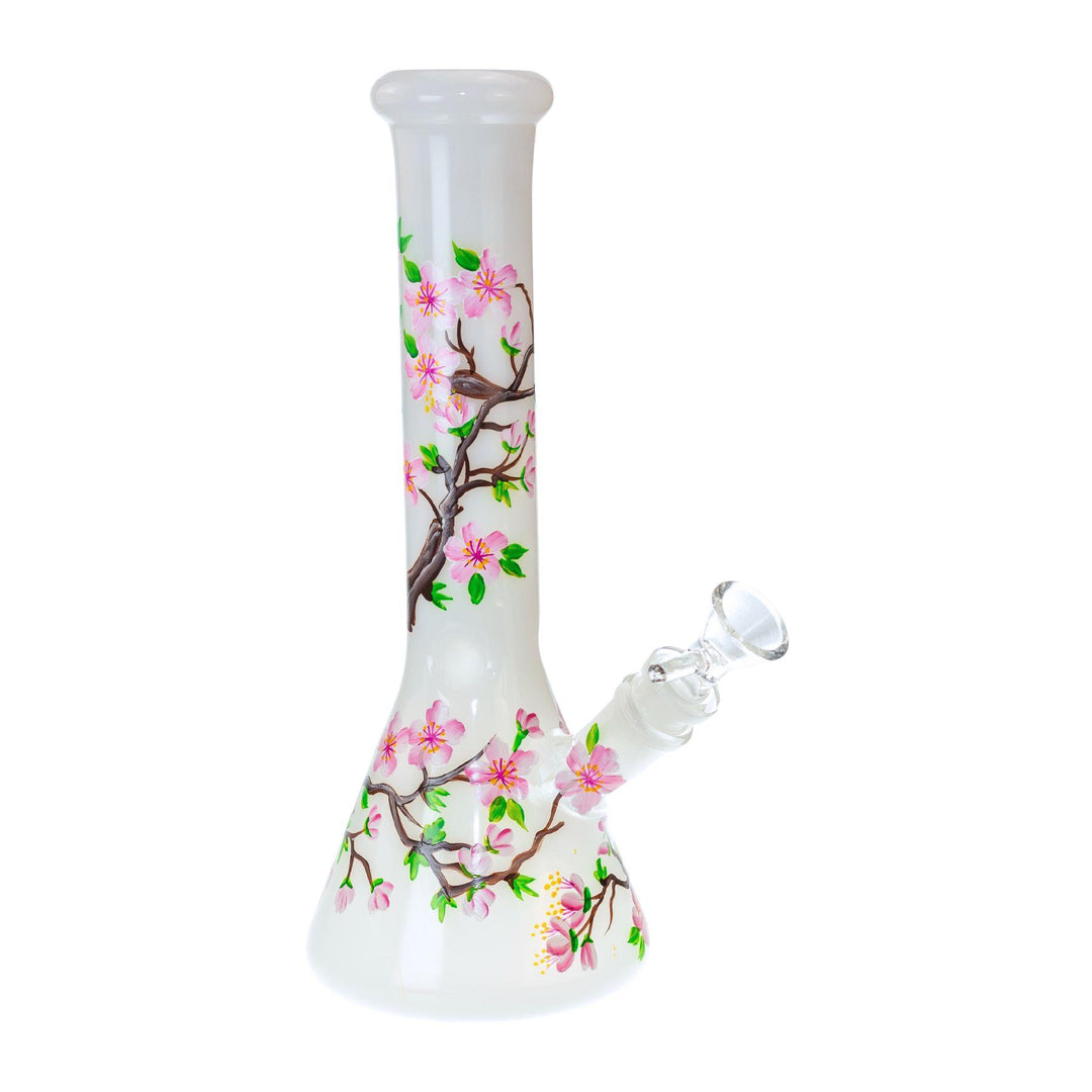 "Studio photograph of a hand-painted cherry blossom water pipe made by Canna Style and sold by Up N Smoke." - Up N Smoke.