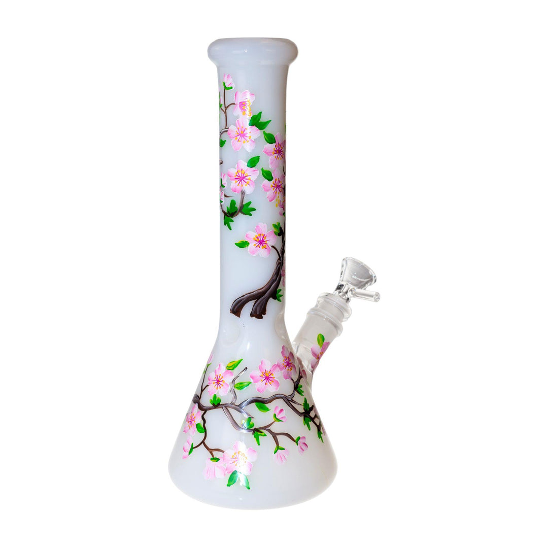 "A back right view of a hand-painted cherry blossom water pipe. The glass is a frosted milky white and adorned with pink flowers." - Up N Smoke.