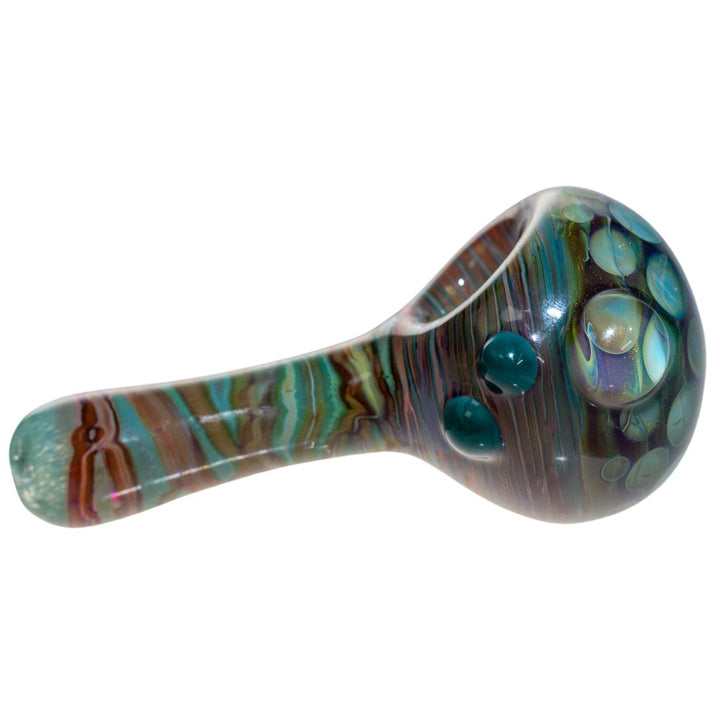 Right side view of a blue Fool Blown Honeycomb Marbled spoon. This piece is adorned with three glass bubbles and has a unique honeycomb design on the front. - Up N Smoke.