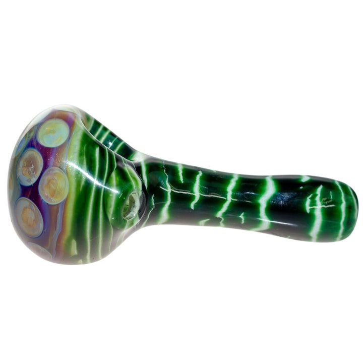 Left side view of a green Fool Blown Marbled Honeycomb piece. Fool Blown Glass creates glass pieces that incorporate layering colored glass to create that unique 'melted' look. - Up N Smoke.