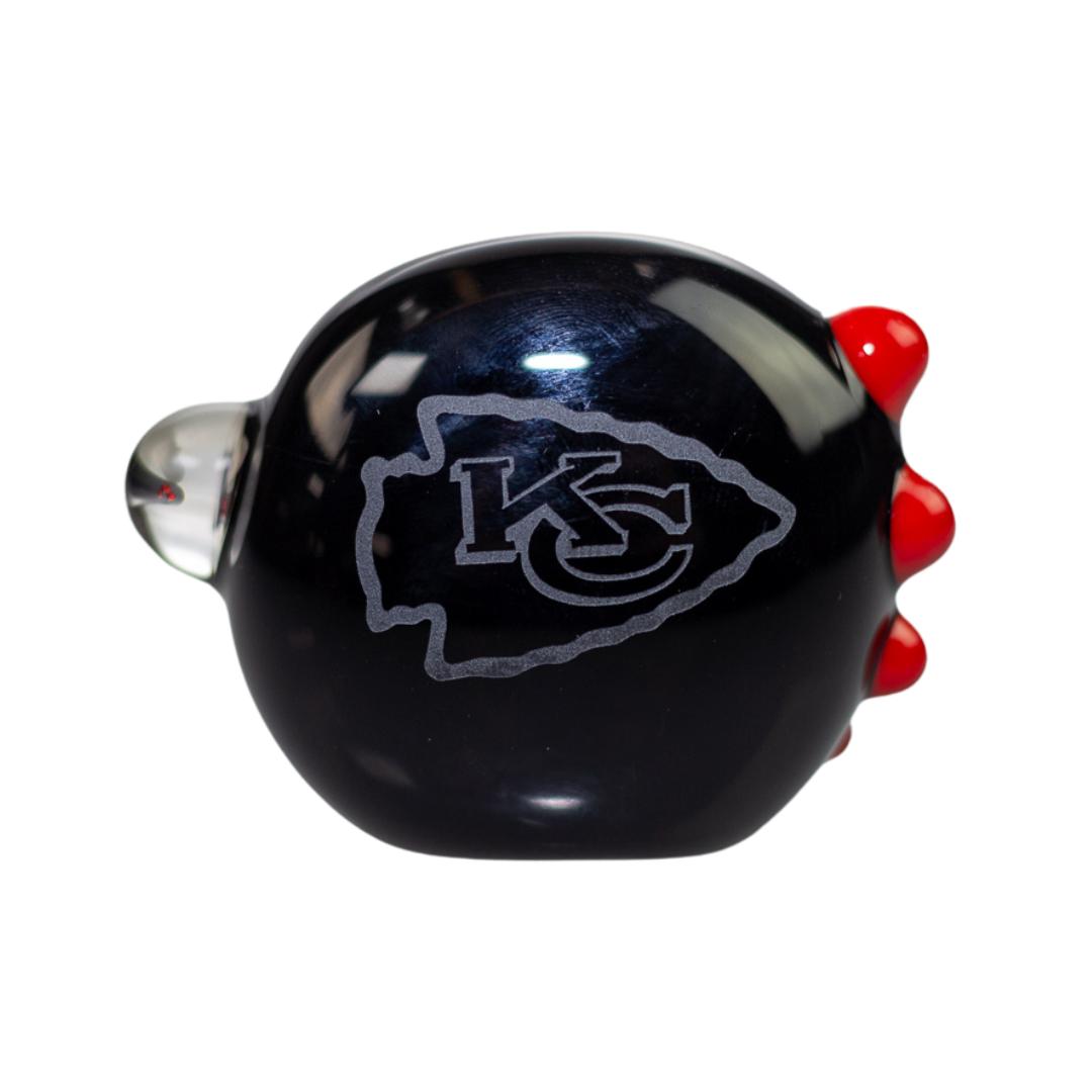 Front view of the head of a Kansas City Chiefs hand pipe with red bubbles. This pieces also features a unique Kansas City Chiefs logo within a marble on the right side. - Up N Smoke.