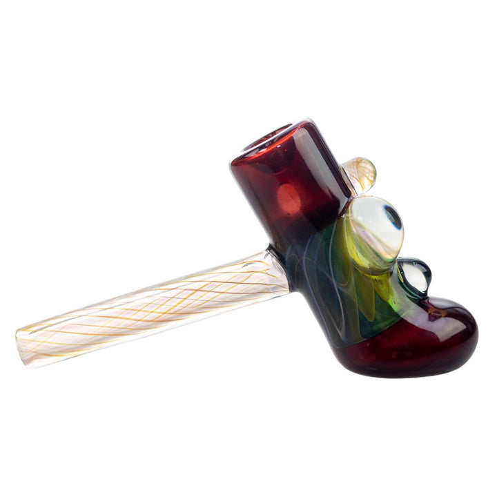 Side right view of a burgundy King Leo hammer. This piece features four glass bubbles of varying colors and techniques utilized to create them. - Up N Smoke.