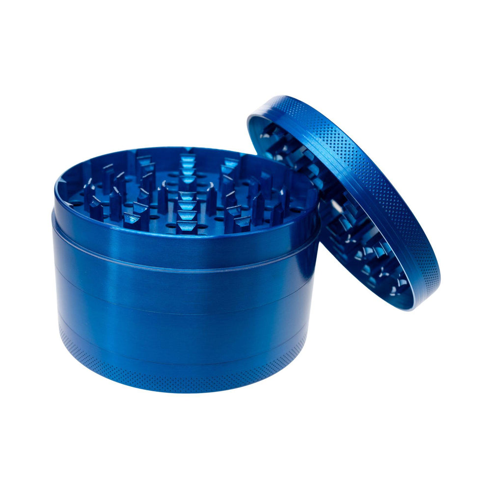 "Large Blue Four-Piece Grinder with its lid propped up against the rest of the tool on a white background," - Up N Smoke.