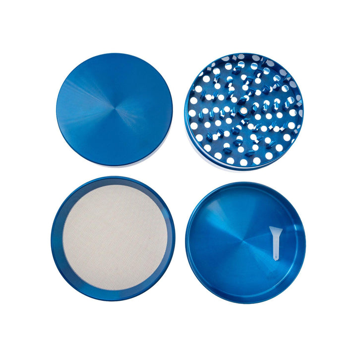 "Four compartments of a Large Blue Grinder laid out separately to showcase each layer of this tool on a white background," - Up N Smoke.