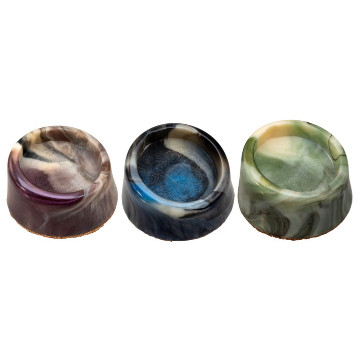 "Group of three Mana Puffco Stabilizers in the colors purple, blue, and green on a white background," - Up N Smoke.