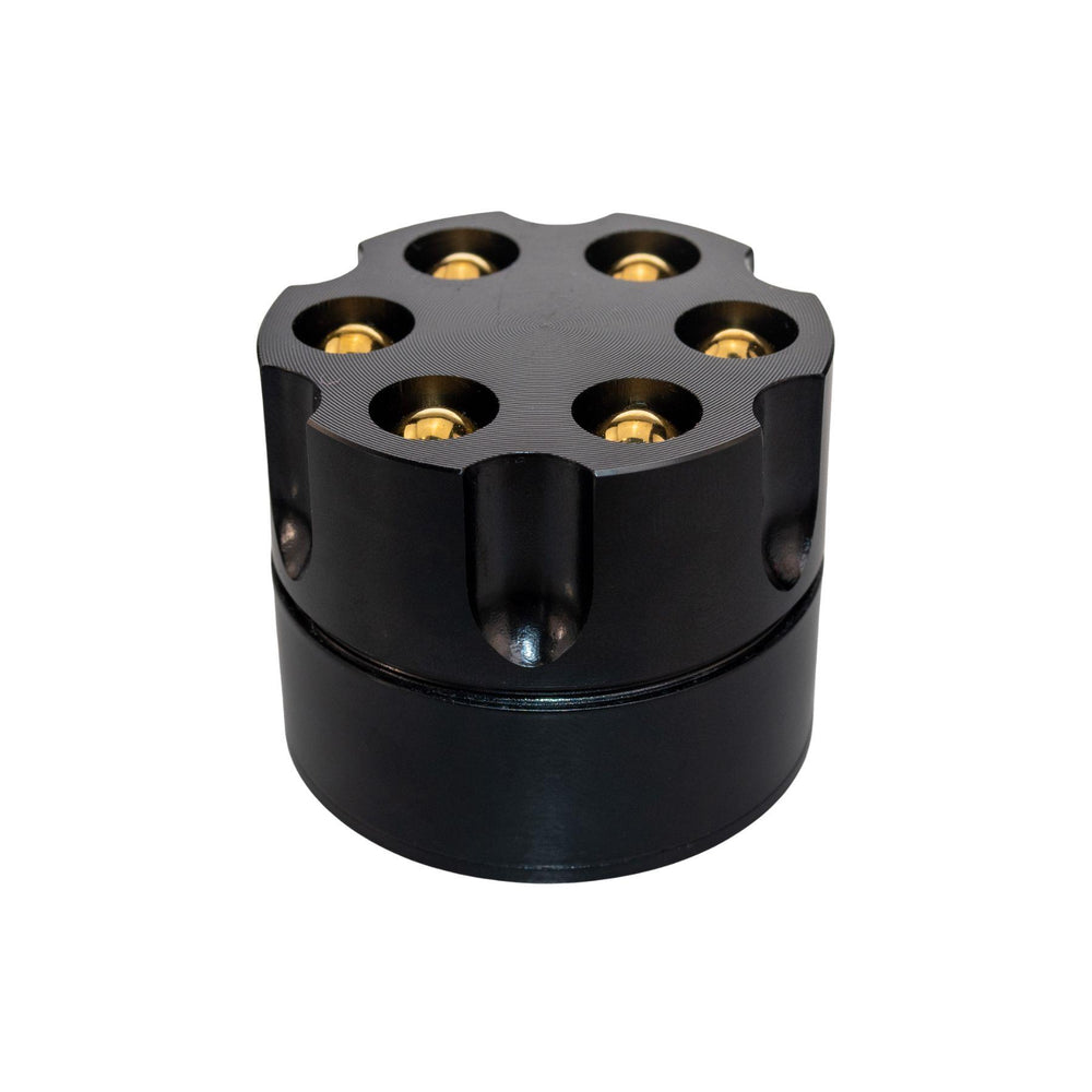 "Grinder made to resemble a revolver bullet chamber on a white background," - Up N Smoke.