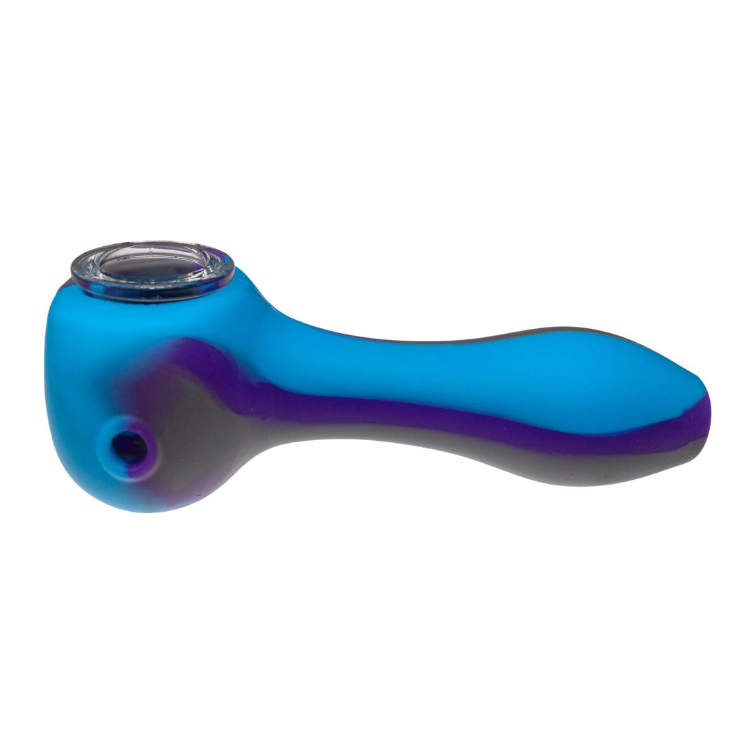 "Left-side of a blue and purple silicone herb spoon against a white background," - Up N Smoke.